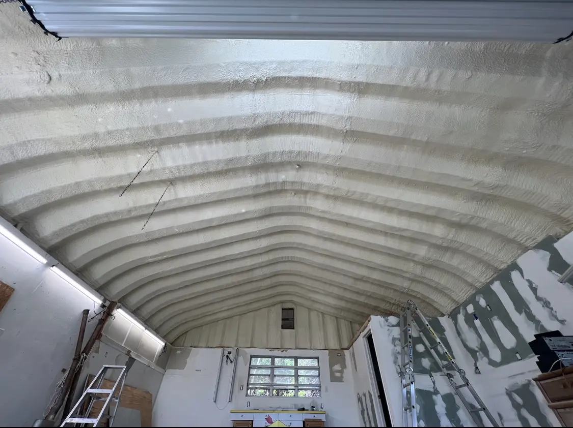 Spray polyurethane foam applied to the underside of a metal roof deck in Haverhill